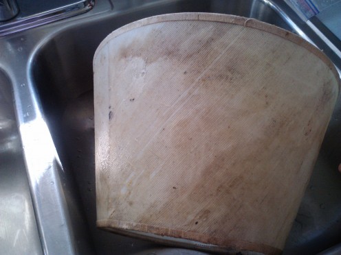 This lamp shade is in deep need for replacement or recovery.  When replacement is out of the picture, then recovery was the only option.