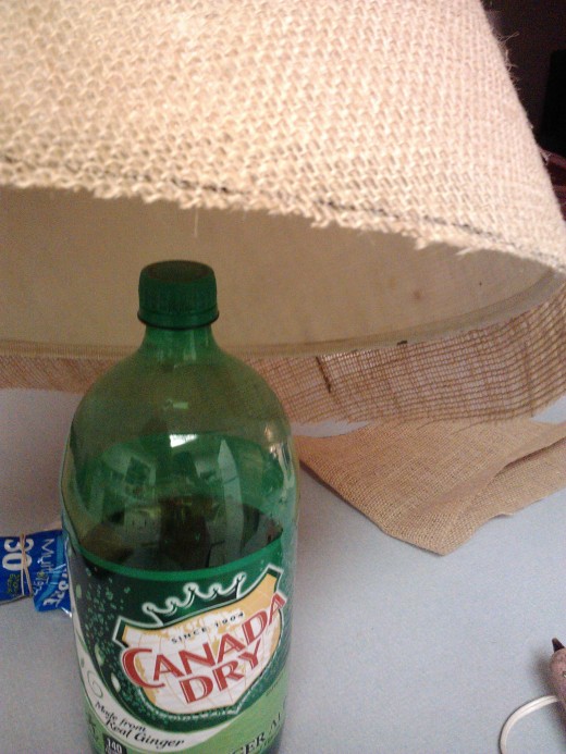 A 2 liter bottle is the perfect stand to work on!