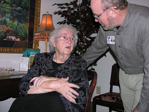 The hospice chaplain supports the patient and the caregiver.