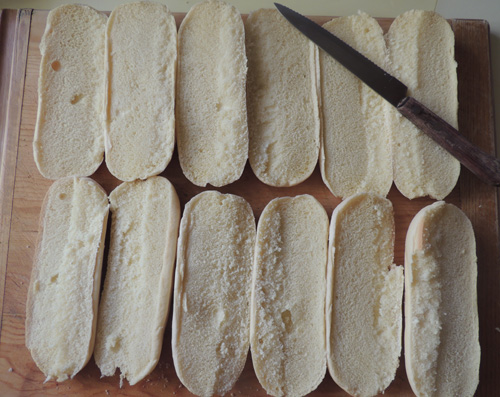 Halve the buns, and arrange on cutting board