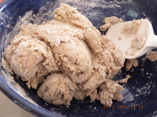 This dough will seem like there is not enough liquid. Keep stirring with a spatula and all the ingredients with incorporate. It will take some upper body strength.