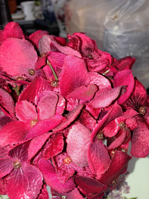 One of my favorite red silk flowers is the red hydrangea. This example shows lots of color variation among the flowers. 