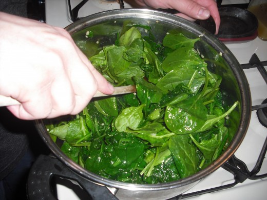 Add spinach.  Sauté until wilted and most of the liquid has evaporated.