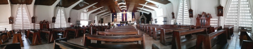 A 180-degree view of the inside of the central Catholic Church in Liberia.  The camera already has a wide-angle view, and the panorama feature makes banner-like photos possible.  The panorama shot is incredibly easy to do.