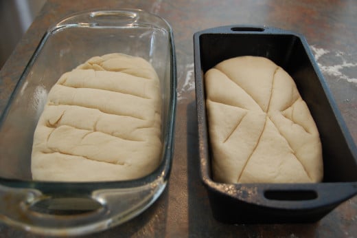 place in pans or on cookie sheets, score the top of each loaf and let raise 30 minutes