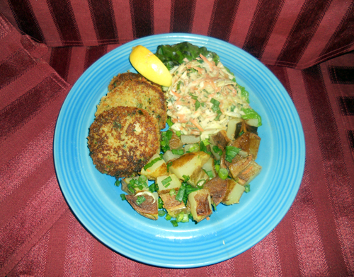 Serving Suggestion features home-made crab-cakes with all fresh crab meat, and roast potatoes. Check back for the crab cake recipe!