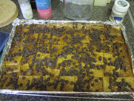 Sprinkle hot caramel and crackers with chocolate chips after removing from the oven.
