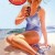 vintage Coca Cola advertisement with blond girl in blue one piece swim suit enjoying a Coca Cola vintage Coca Cola advertisement with blond girl in blue one piece swim suit enjoying a Coca Cola