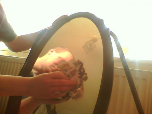 Jimmy can actually be useful around the house and always uses a newspaper to clean glass surfaces. On with wet newspaper