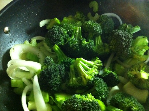 Add chicken broth and broccoli florets