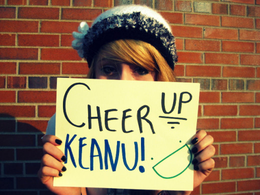 A Young Woman Offering Keanu Reeves Her Support On "Cheer Up Keanu Day"