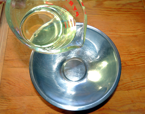 pour oil in a mixing bowl