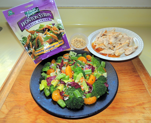 now add: broccoli, snap peas, & mandarin orange slices. Top with crunchy wontons, nuts & chicken shreds