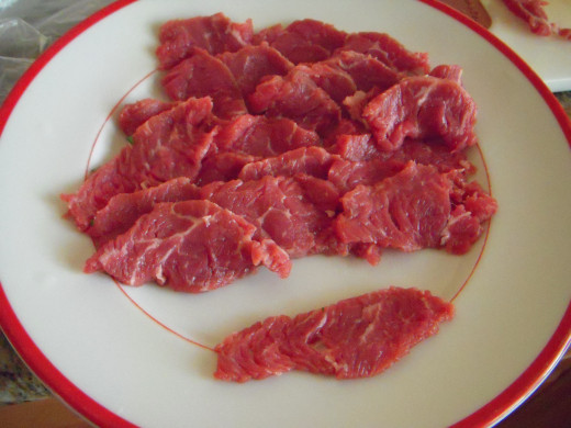 Use a good cut of beef, sliced about 1/8" thick. These slices are a little small but are about the right thickness. 
