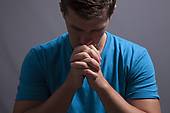 a young man prays for guidance