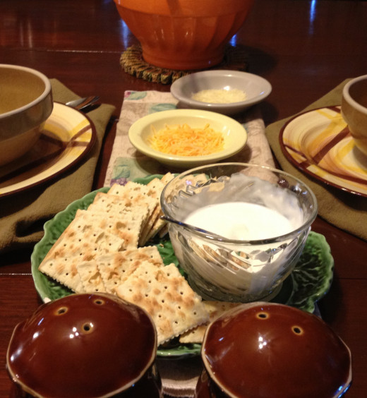 I serve with sour cream, freshly grated  Parmesan cheese and grated cheddar cheese.  
