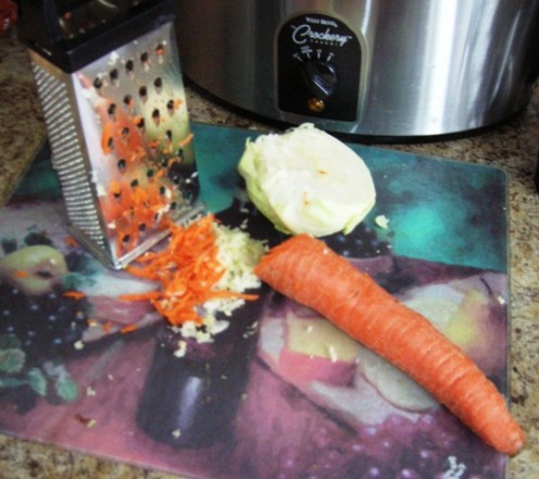 shredded carrots and cabbage; making slaw Bob Ewing photo