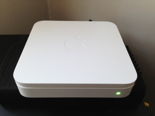 Apple Airport Extreme is small (w 61/2'' x L 6/12'' x H 11/2 ) The unit lays horizontal.   