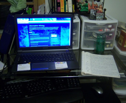 My laptop, keyboard, mouse and Hubpages notebook.