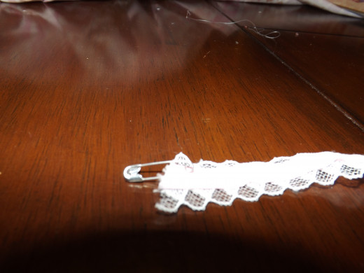 A pin attached to one end of your ribbon is used to thread it through the casing.