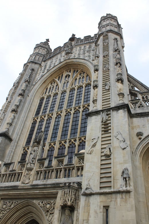 The front of Bath Abbey showing its famous 'Jacob's ladder' carvings on the towers.