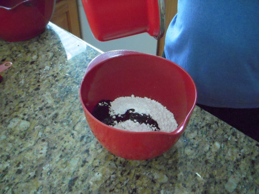 For icing, melt together margarine and chocolate in pan and add to powdered sugar in a small bowl.