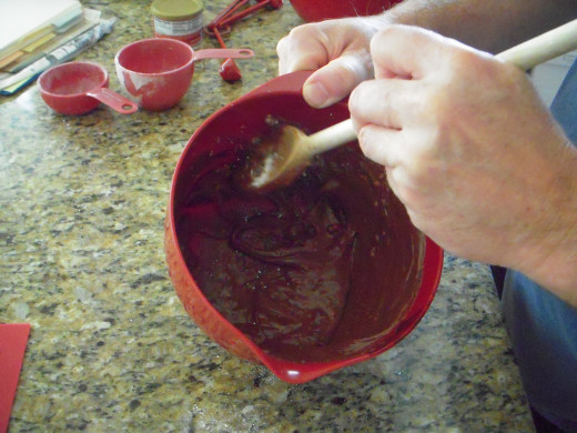 Mix icing in bowl until it is just fluid enough to pour.