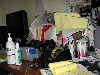 A clutter-filled (and dangerous!) desk