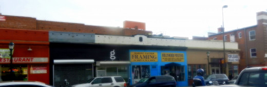 Emilio's neighbors: a poster shop and an abandoned business.