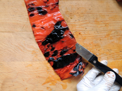 slip sharp paring knife carefully between skin and pepper