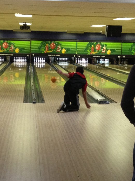 It's a group effort.  It's your turn, but you are bowling with the whole team behind you! 