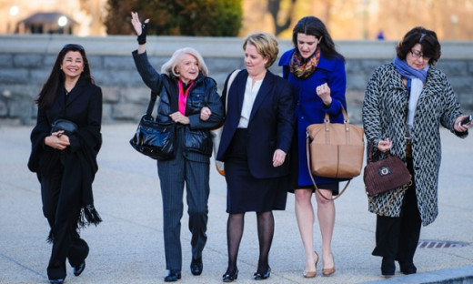 Edith Windsor, second left, arrives at the supreme court in Washington on Wednesday morning as the court is to hear arguments in her case against on the constitutionality the 1996 Defense of Marriage Act. Photograph: Pete Marovich/ZUMA Press/Corbis