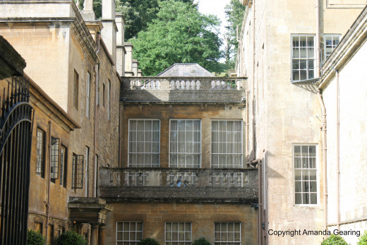 The old farmhouse roof can be seen between the two new wings of the house.