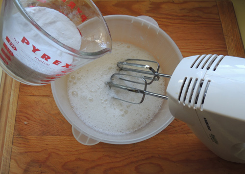 gradually add mix of sugar and cream of tartar