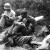 Msgt Frank Chandler, US Army 5th Regimental Combat Team, comforts a soldier who had just identified his best friend's body.