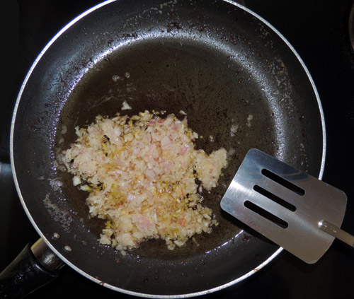 using the grease you cooked chicken in, shallots go to pan first