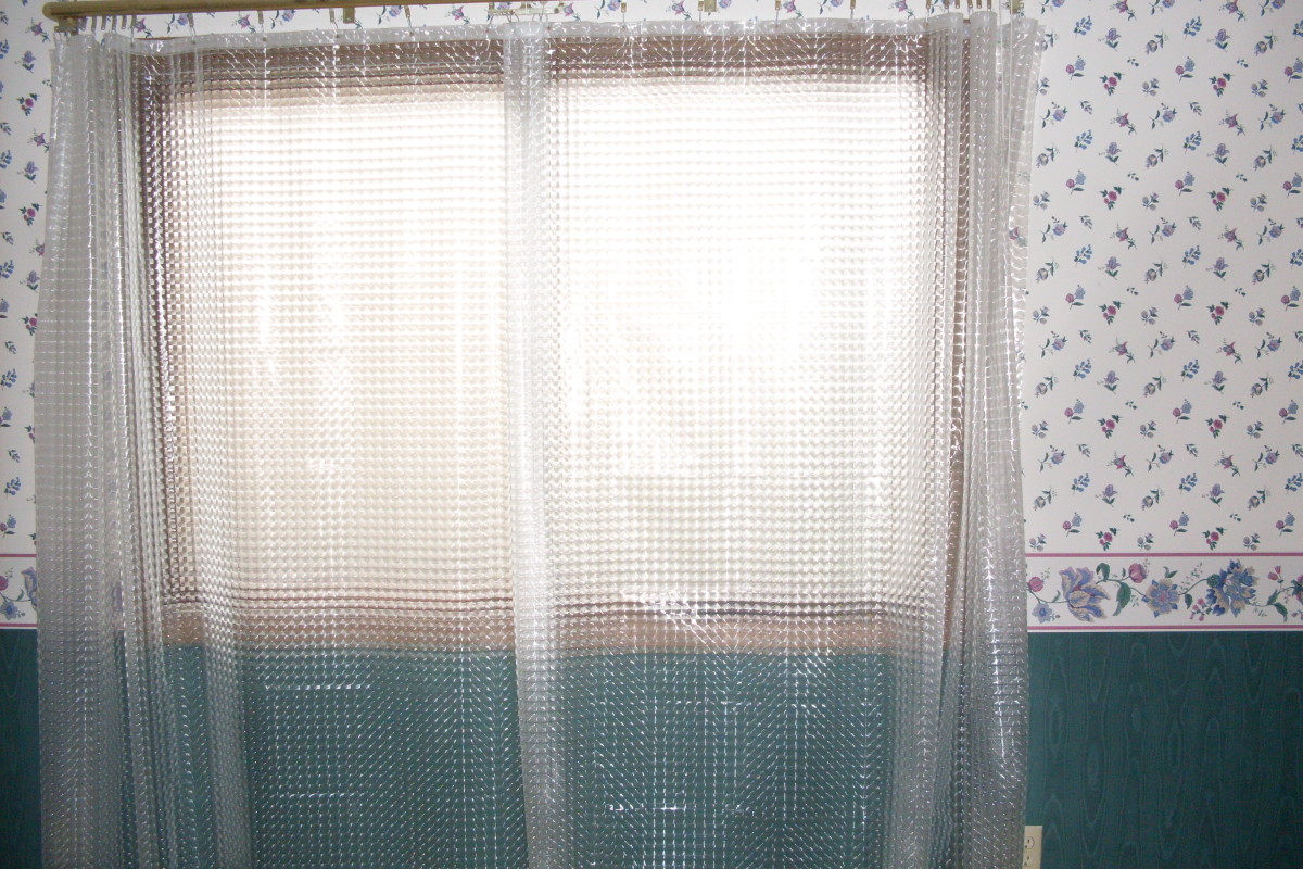 Patterned shower-curtain liner drapes pulled closed, just like regular drapes. From the outside, they simply appear to be white sheer curtains.