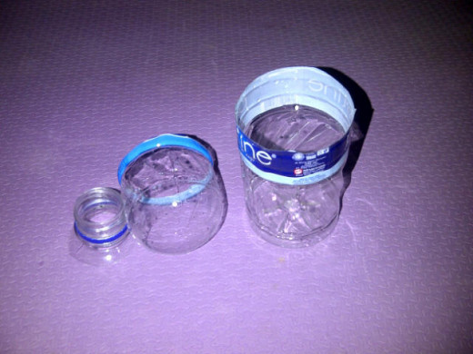 Fig 2: Cut bottle 1 around 6 cm below the bottle thread. Cut the thread off too. We'll use it as the head.