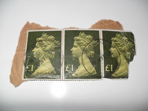 An example of how NOT to remove stamps from an envelope. Don't cut or rip the paper too close to the stamps! You risk ripping your stamps.