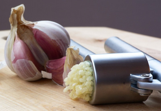 Garlic crushed using a garlic press, ready for use is ideal for use in health enhancing remedies.