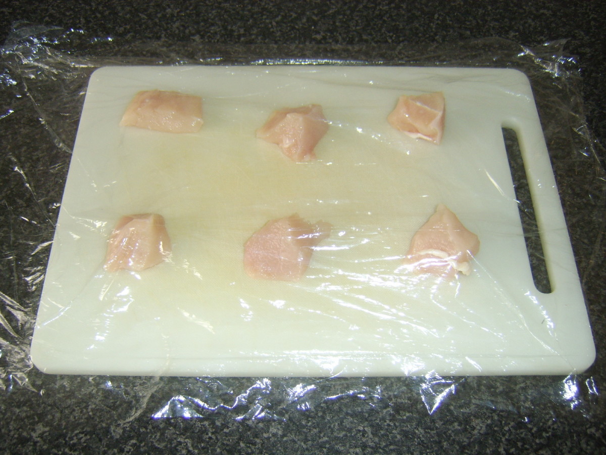 Preparing to pound and flatten chicken cubes
