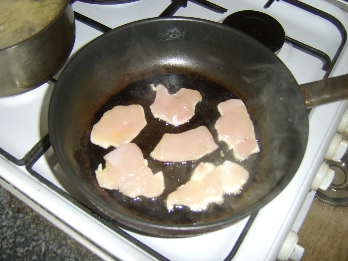 Pan frying the chicken strips