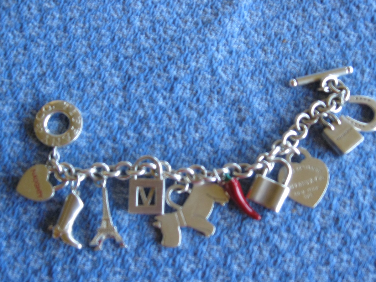 This charm bracelet and charms are from Tiffany. A word of caution, they are often reproduced 