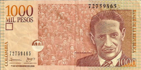 Jorge Eliecer Gaitan in a $1,000 Colombian pesos bill (roughly 60 cents) with his populist support on the background. 