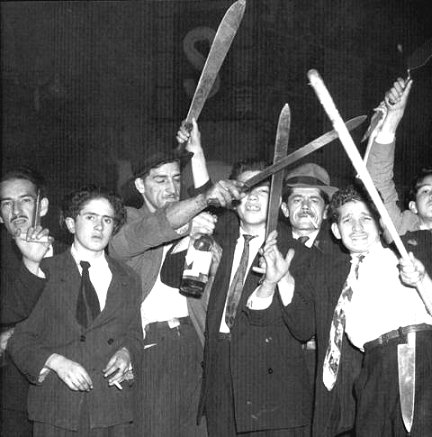 A mob of liberals gather with machetes on the streets