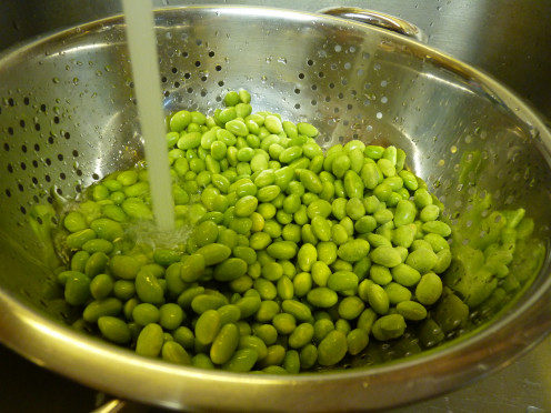 Pour soybeans into colander and run under hot water to thaw.