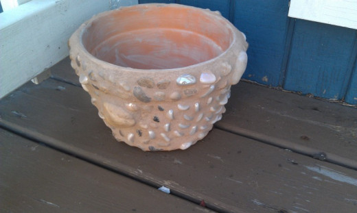 I made this planter from a friends leftover stones from her wedding center pieces, crafty and reusing. 