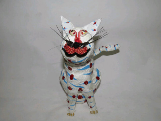 The result: A white sitting cat figurine.