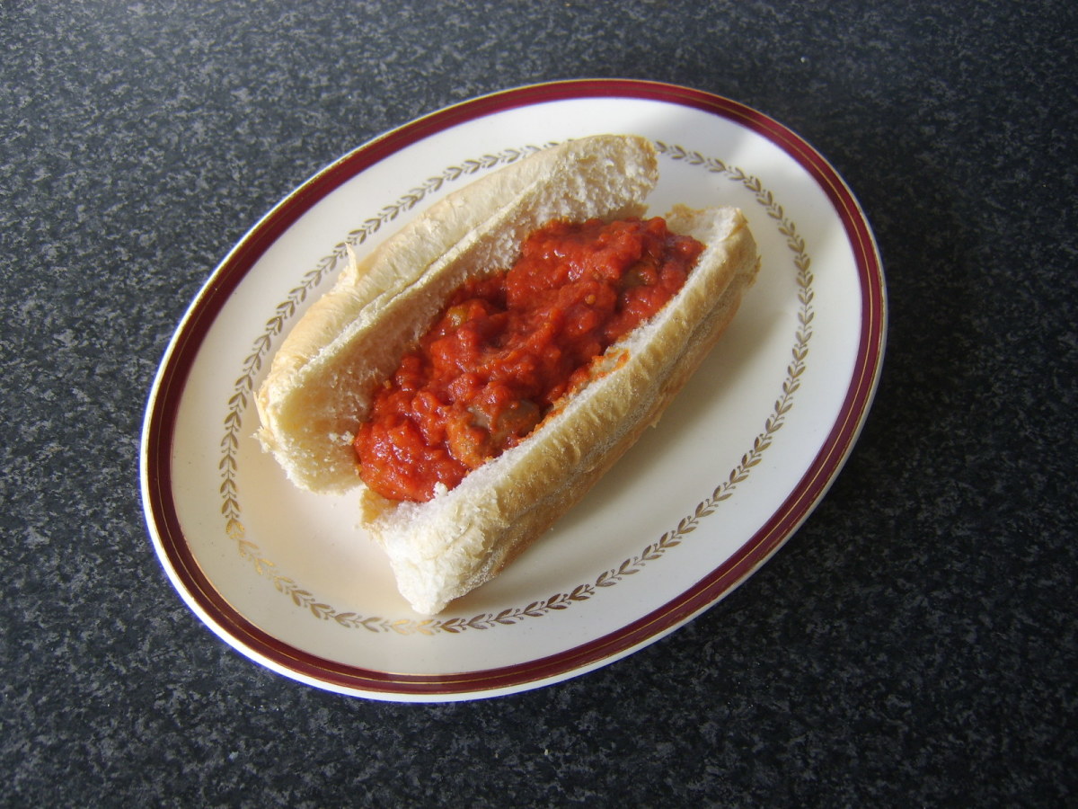 Spicy sausage and tomato is spooned in to sub roll