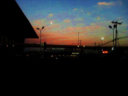 the house, at the setting sun